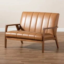 Nikko Mid-Century Faux Leather Upholstered Wood Loveseat Walnut/Brown - Baxton Studio -Home Furniture Shop-Baxton Studio GUEST 523a5df4 2552 4576 a2e6 22ac3329118d